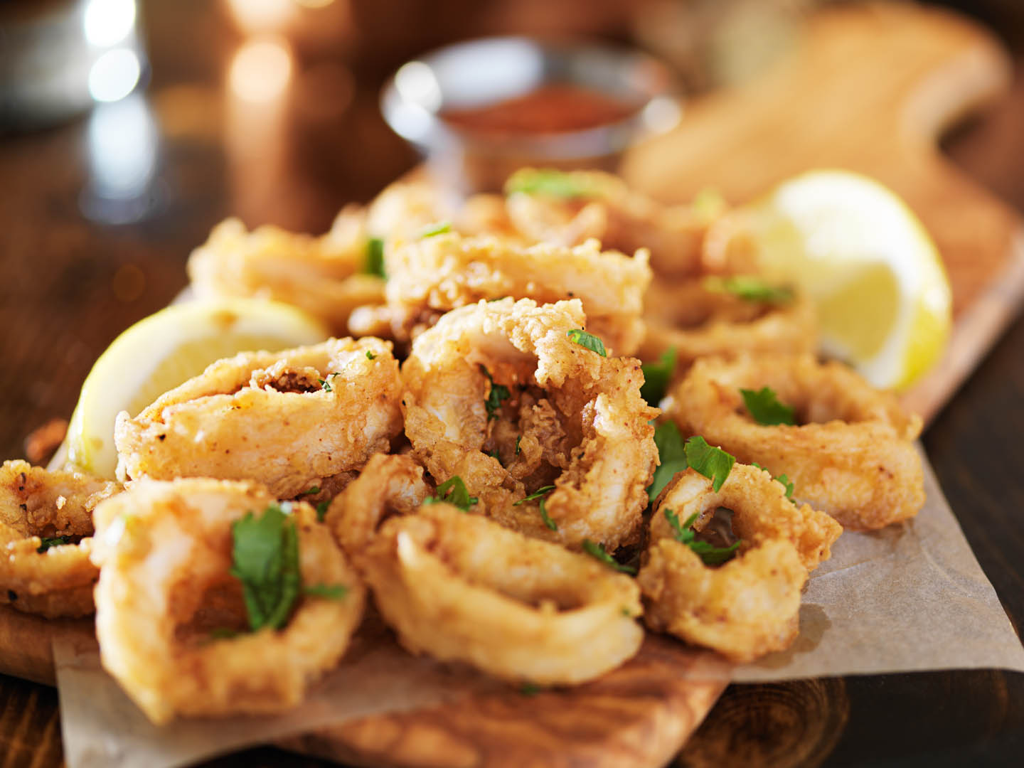calamari rings on a board with lemon